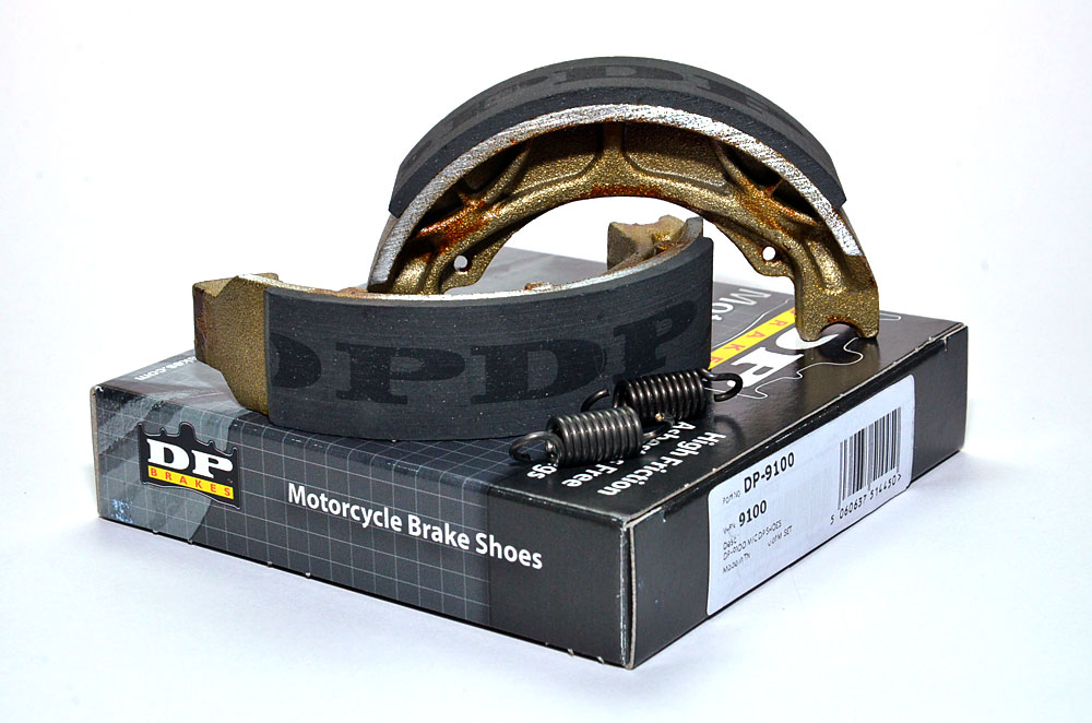 9100 DP Brakes motorcycle brake shoes on top of their packaging