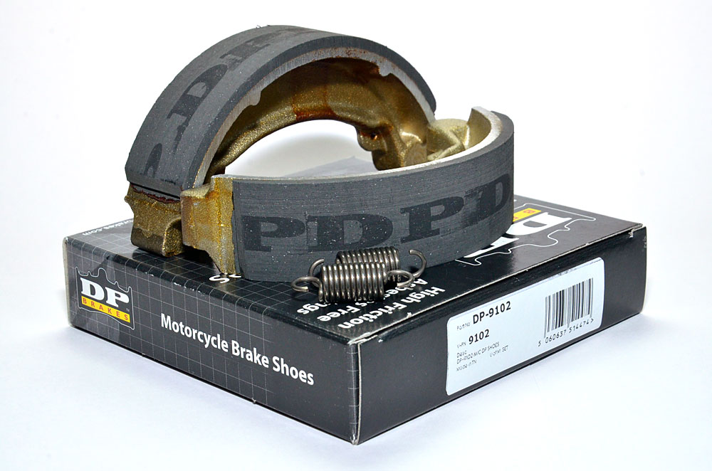9102 DP Brakes motorcycle brake shoes on top of their packaging