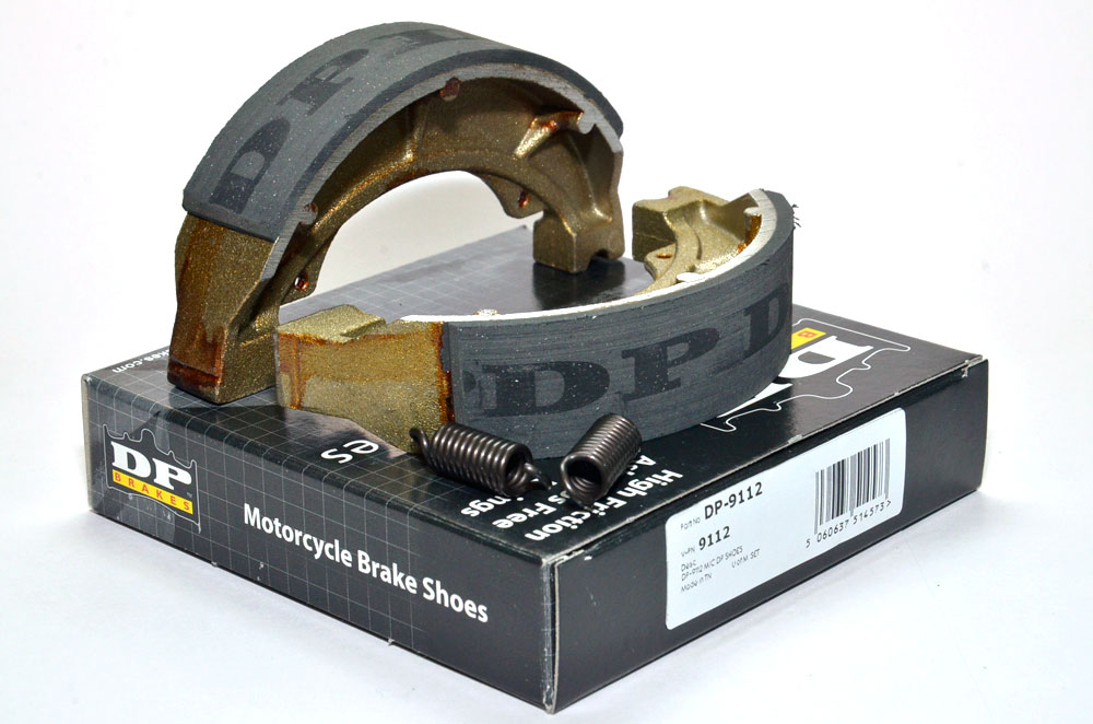 9112 DP Brakes motorcycle brake shoes on top of their packaging